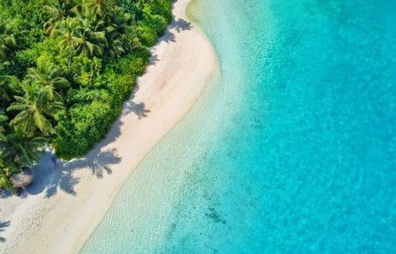 aerial view of a pristine beach in the maldives