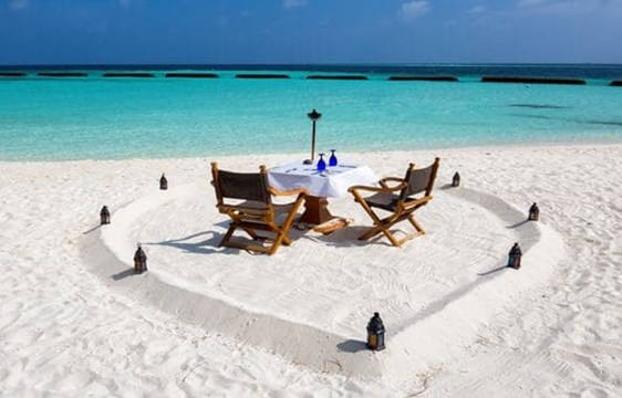 romantic private lunch on a white sandy beach in the maldives